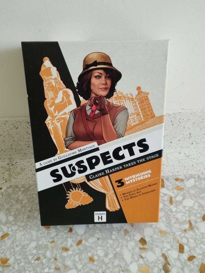 dwóch graczy z lupami nad planszą autopsji w Obduktio