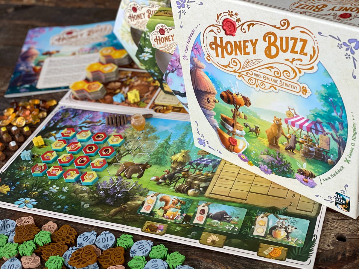 gracz analizuje karty akcji z ikonami handlu i produkcji na stole